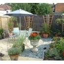 circular paving and plants in seating area of a garden